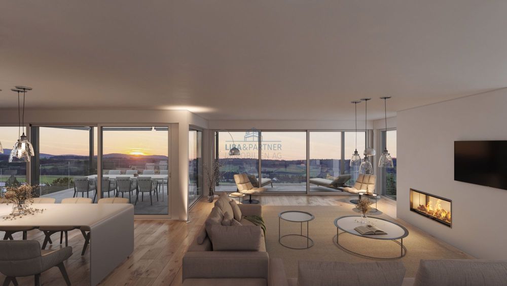 «The View» - Stilvolles Wohnen mit Weitblick in Rodersdorf - Wohn- Essbereich bei Abendstimmung / Living and dining area in the evening