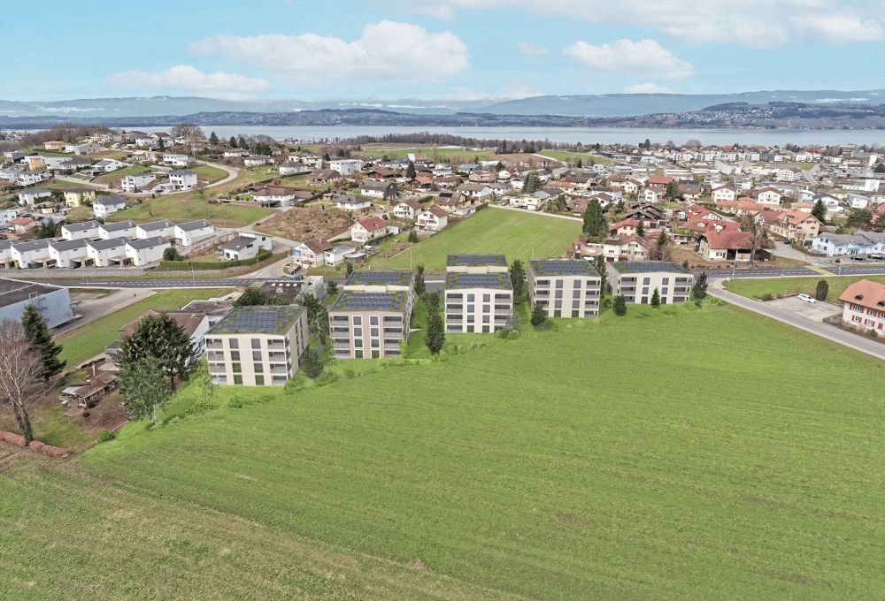 Courgevaux - Moderne 3.5 Zimmerwohnungen mit Abendsonne - Vogelperspektive