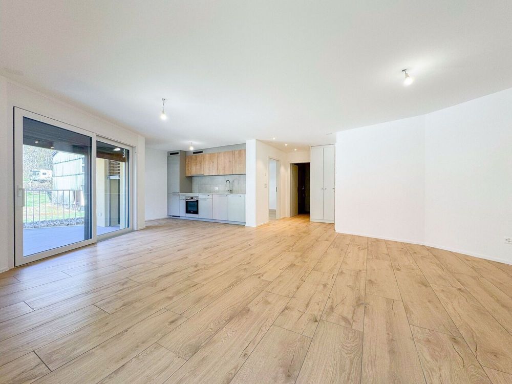 Appt PPE neu von 2,5 Zimmern mit Balkon Campagne Pernod, Lot B7 - Exemple d'agencement intérieur cuisine et séjour (bâtiment A - 2.5 pièces)
