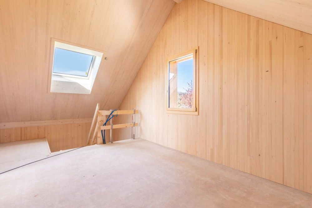 Einzigartige Holz-Einfamilienhäuser - Dachgeschoss mit Dachfenster