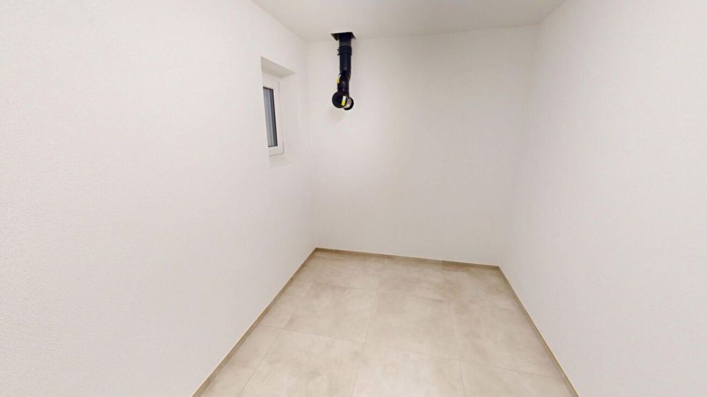 Neubau-Doppeleinfamilienhaus in Buchs SG - Stilvoll wohnen mit Nachhaltigkeit und Komfort - Keller 1