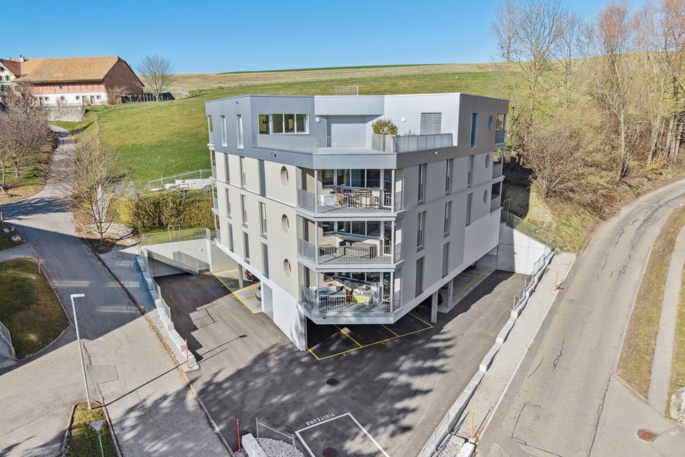 Magnifique appartement neuf au 2ème étage d'une petite PPE - L'immeuble / Das Gebäude / The building