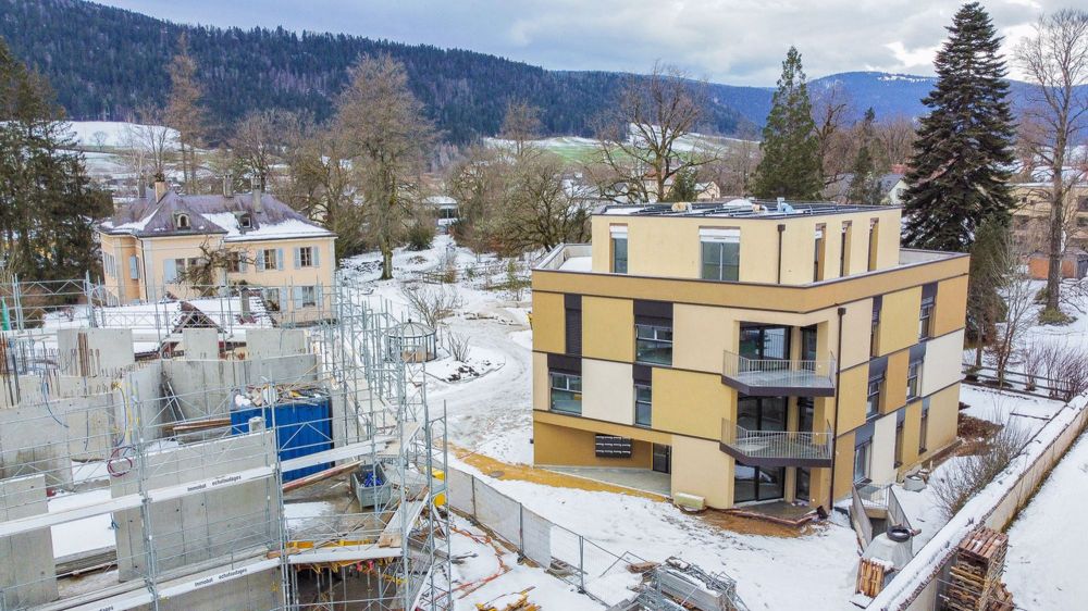 Appt PPE neuf de 2.5 pces avec terrasse Campagne Pernod, lot A1 - Vue aérienne sur le bâtiment