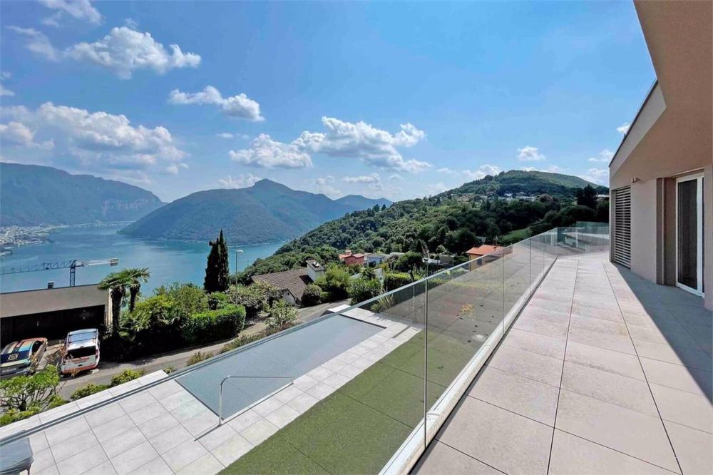 Attico dominante con vista lago a Carona - Bild 1