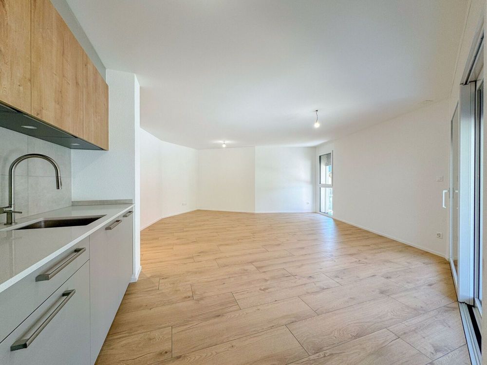 Appt PPE neu von 2,5 Zimmern mit Balkon Campagne Pernod, Lot B7 - Exemple d'agencement intérieur cuisine et séjour (bâtiment A - 2.5 pièces)