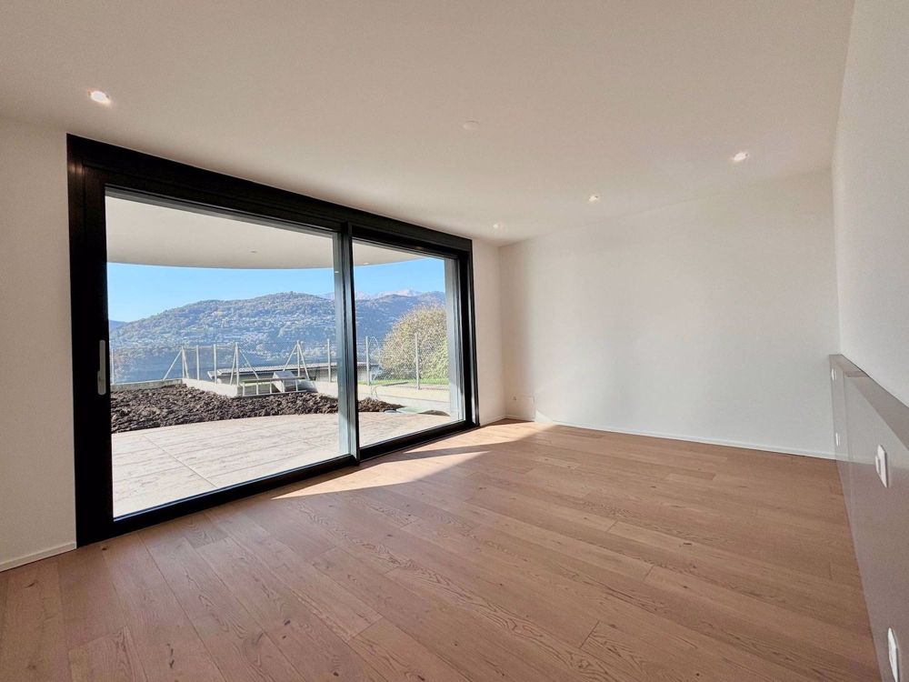 Luminoso appartamento con giardino e vista lago - Bild 1