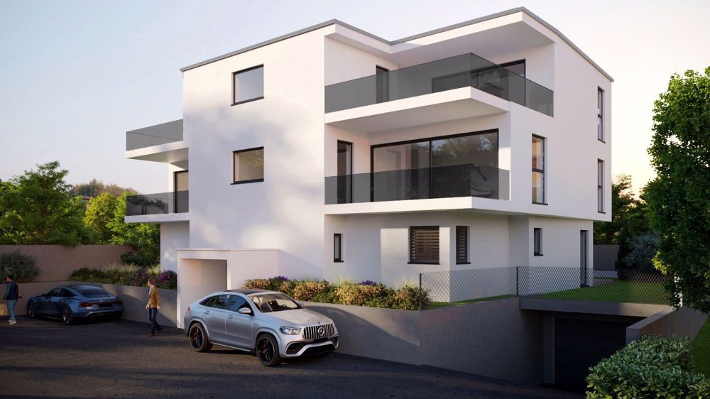 Nel Cuore della Zona Residenziale di Comano: Attico di Prestigio con Vista Panoramica - Bild 1