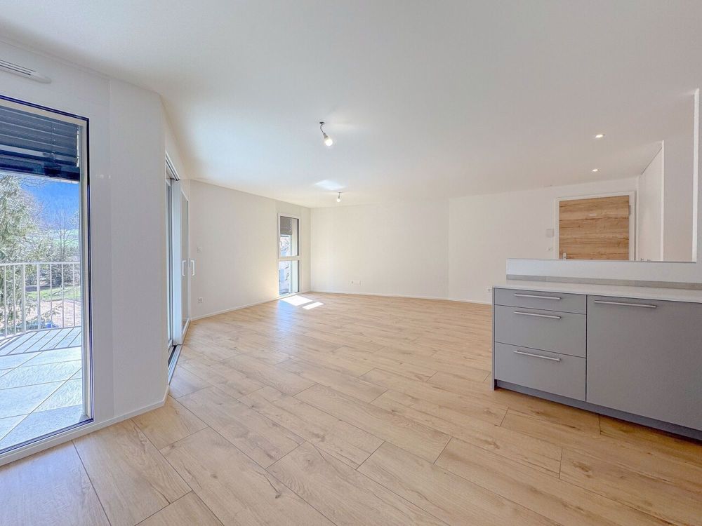 Appt PPE neu von 4.5 Zimmern mit Balkon Campagne Pernod, Lot B9 - Exemple d'agencement intérieur cuisine et séjour (bâtiment A - 4.5 pièces)