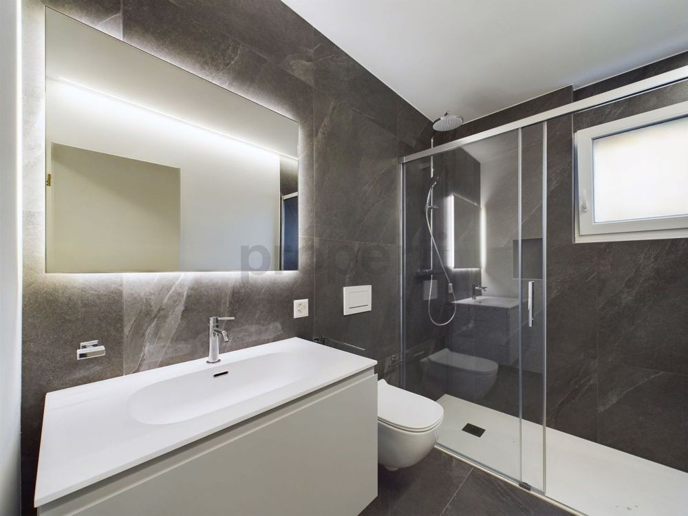 Helles 2,5-Zimmer-Apartment mit Garten in neuem Bau in Lumino - Image 4
