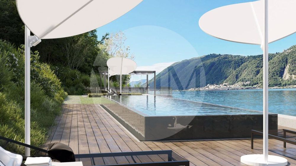 ELEGANTE BILOCALE FRONTE LAGO CON VISTA INCANTEVOLE - Bild 7