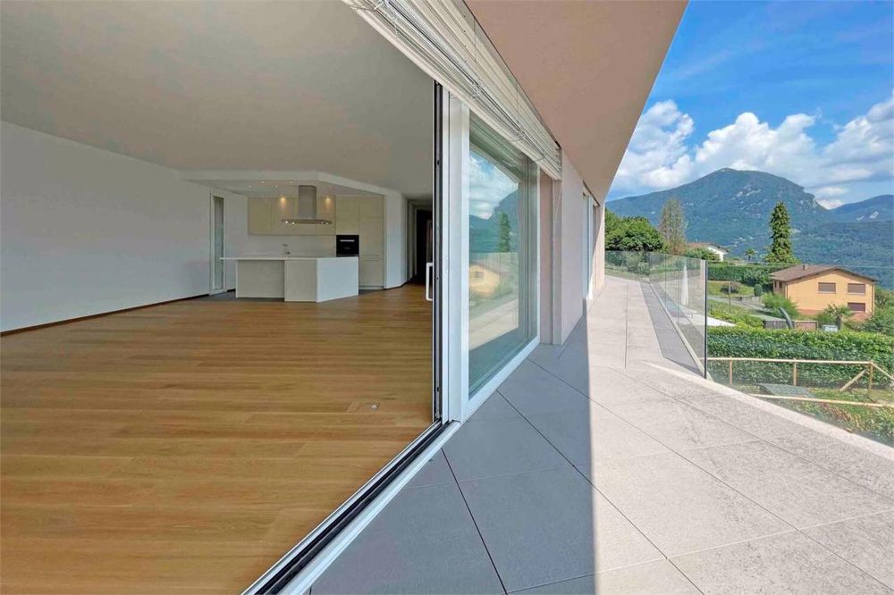 Attico dominante con vista lago a Carona - Bild 3