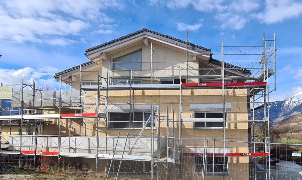 Bel appartement neuf de 4.5 pièces au rez EST, possibilité en 3.5. - Bild 1