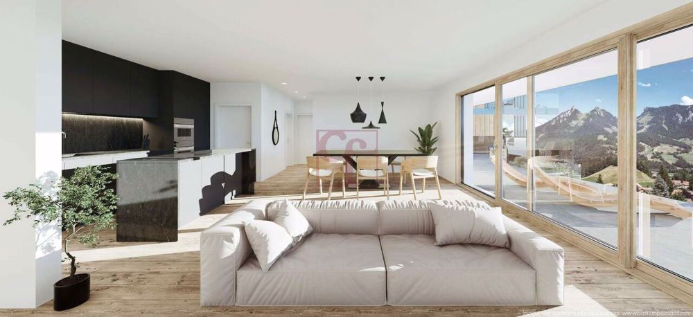 Enney - Résidence de l'Ondine - Appartement neuf de 4.5 pcs - Cuisine ouverte sur le coin à manger avec accès sur le balcon