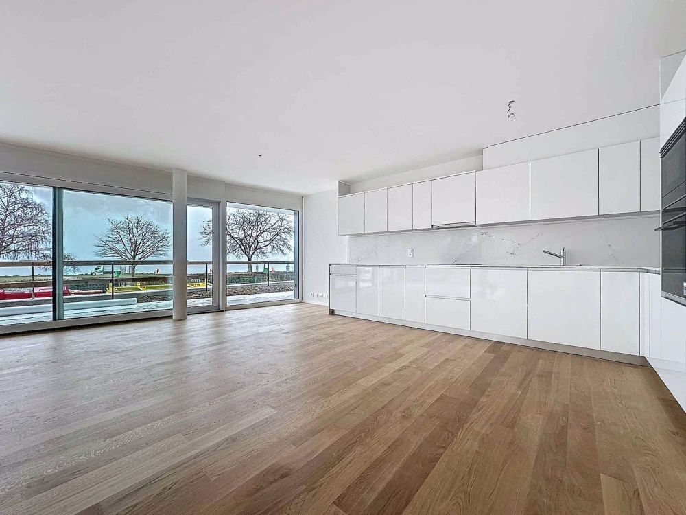 Exceptionnel 5.5 pièces au rez-de-chausée avec terrasse et jardin privatif vue lac - Bild 1