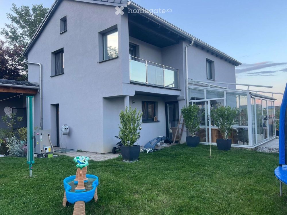 Modernes Einfamilienhaus mit Einliegerstudio und Traumgarten - Bild 3