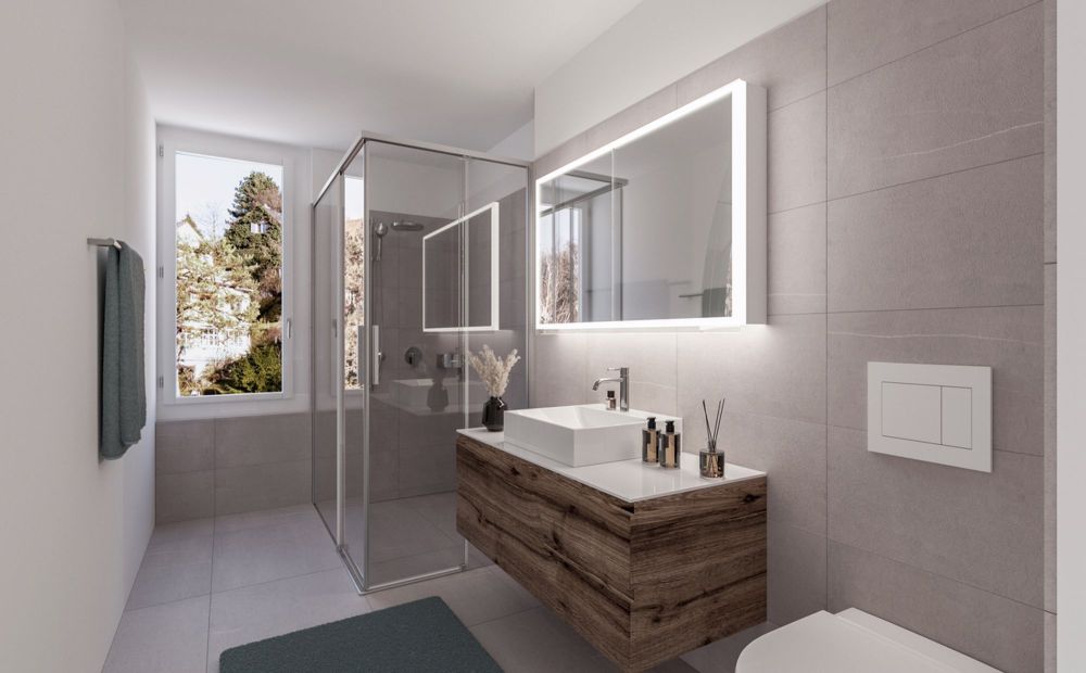 Neubau EG-Maisonette-Wohnung an schöner Lage (C-1.0) - ein modernes Badezimmer mit Toilette, Waschbecken, Dusche und Spiegel / a modern bathroom with a toilet, sink, shower and mirror