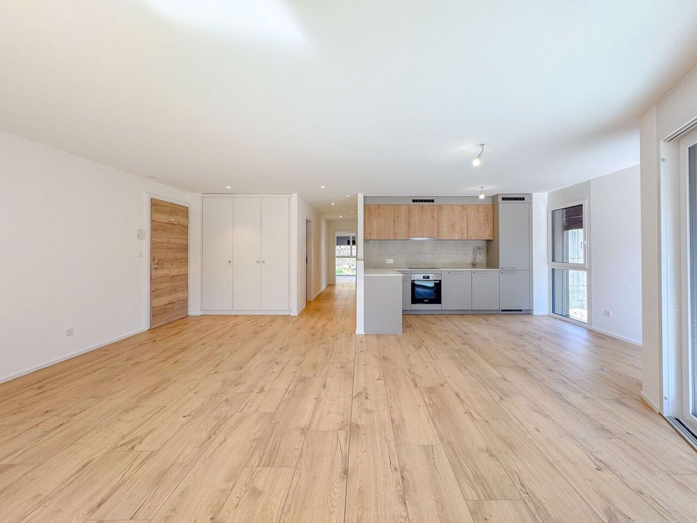 Appt PPE neu von 4.5 Zimmern mit Balkon Campagne Pernod, Lot B9 - Exemple d'agencement intérieur cuisine et séjour (bâtiment A - 4.5 pièces)