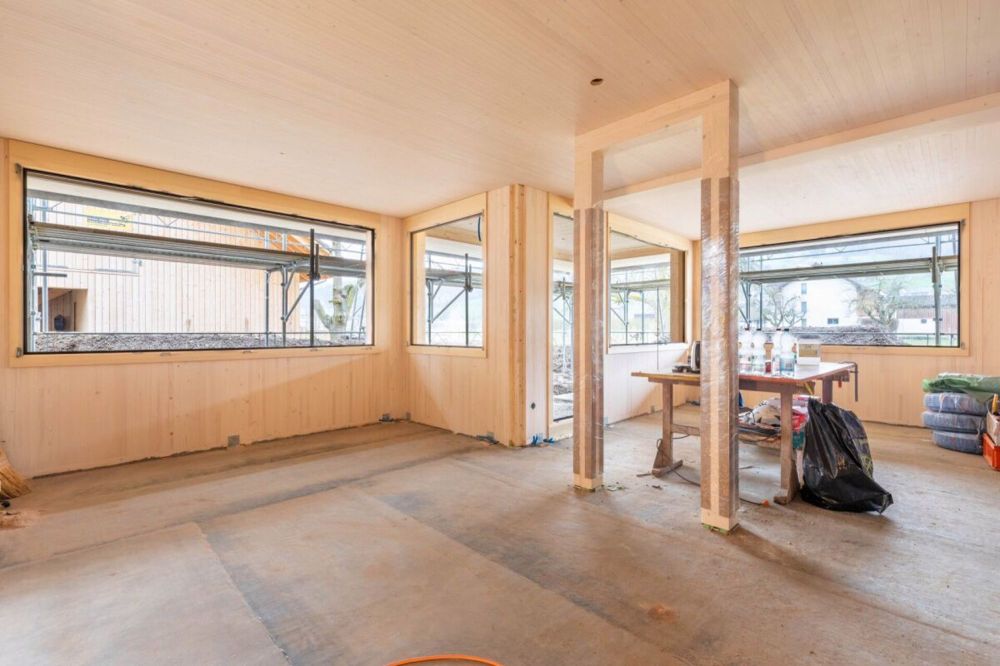 Einzigartige Holz-Einfamilienhäuser - Wohn- und Esszimmer