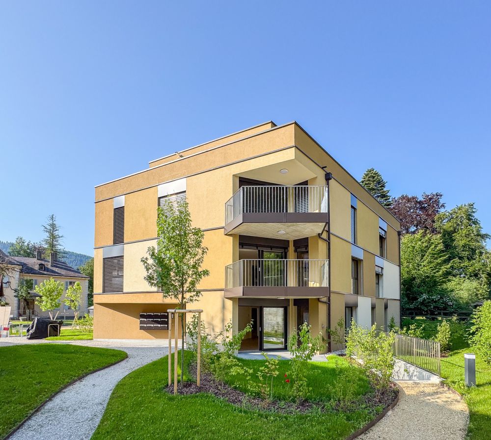 Appt PPE neuf de 2.5 pces avec balcon Campagne Pernod, lot B7 - Vue sur le bâtiment A et les extérieurs