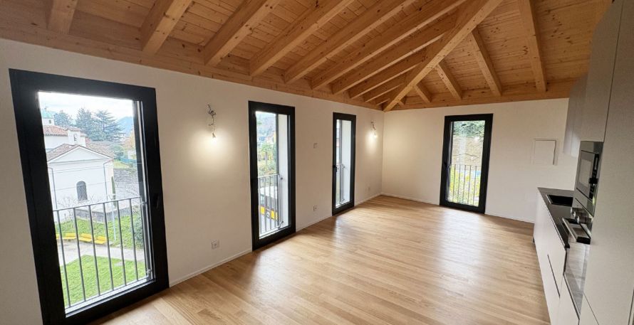 Attico Esclusivo con Vista Lago a Pura - Comfort Moderno in Posizione Idilliaca - Image 1
