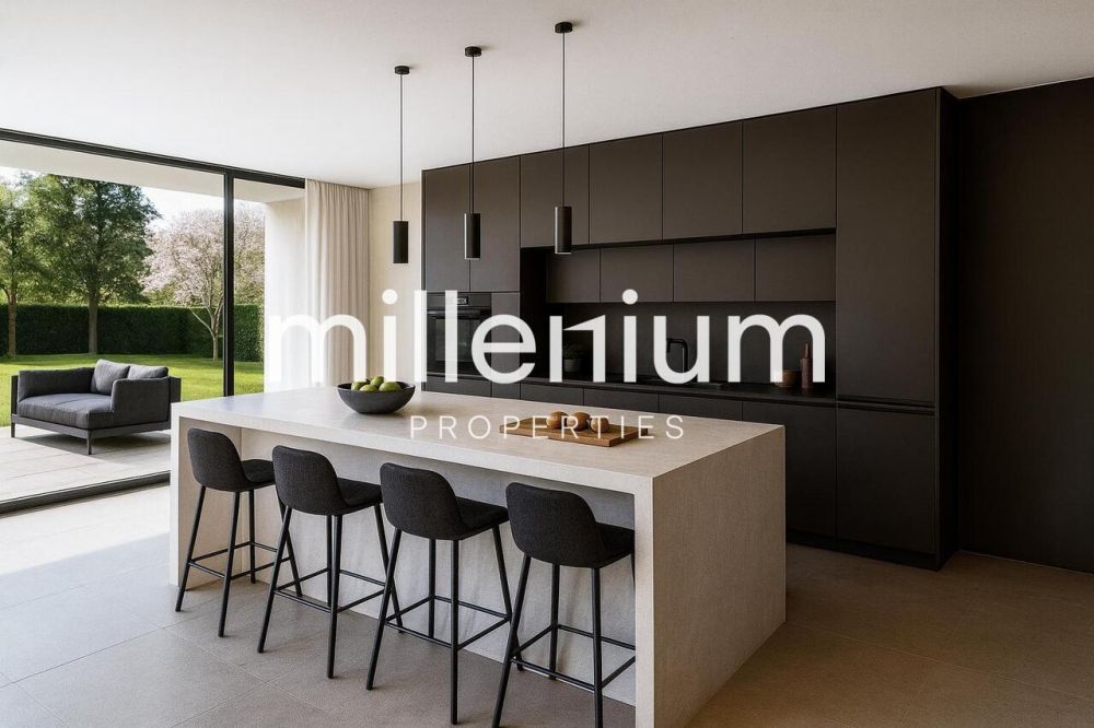 Villa contemporaine neuve à 100 m du Lac à Vésenaz - une cuisine moderne avec un grand îlot au milieu de la maison / a modern kitchen with a large island in the middle of the house