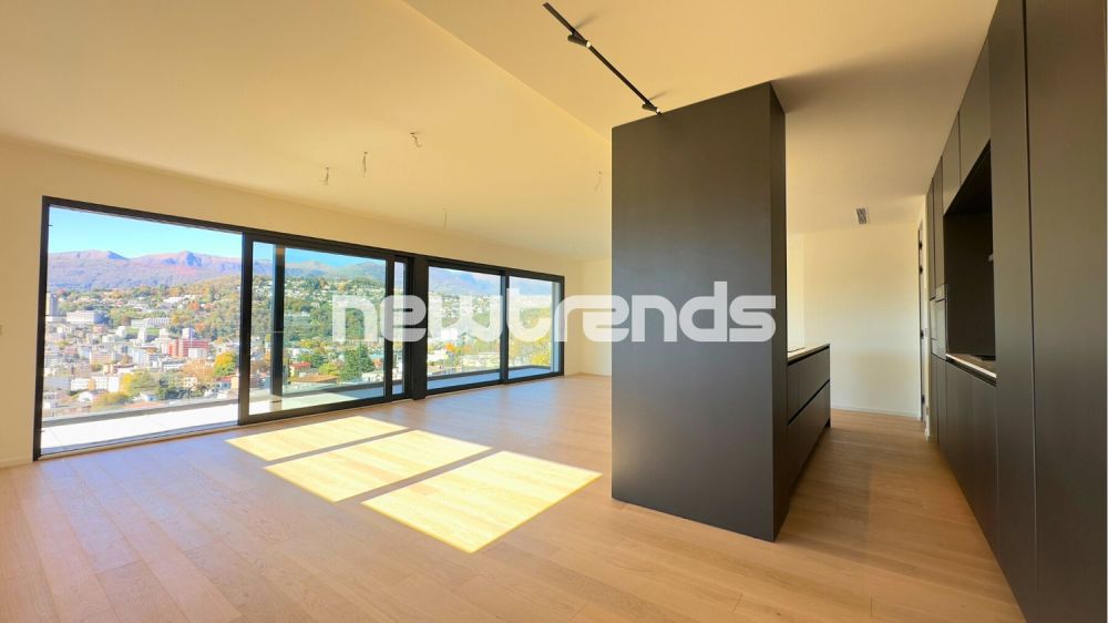 Viganello: 4,5 locali nuovi con vista aperta e parziale lago. - dettagli open space