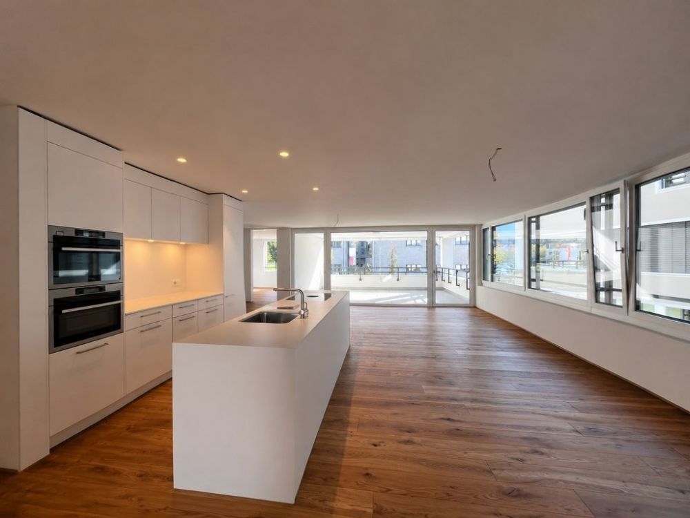 Modern wohnen in Cazis - Ihr neues Zuhause wartet auf Sie - B1.1_Kueche_Essbereich.png