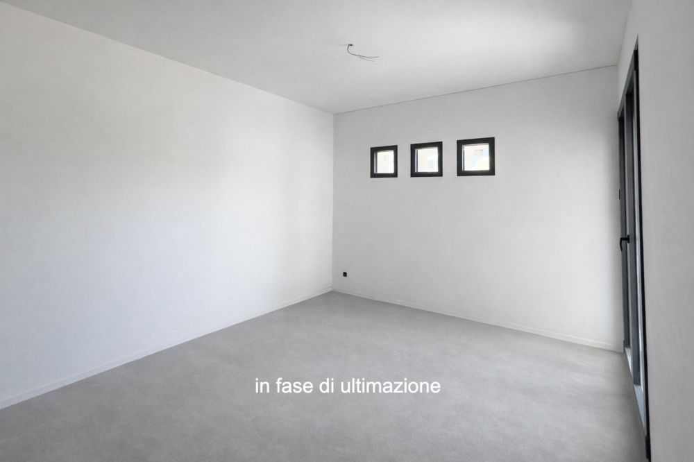 Moderno e nuovo 3.5 locali duplex con giardino a Melano -  Bild 2