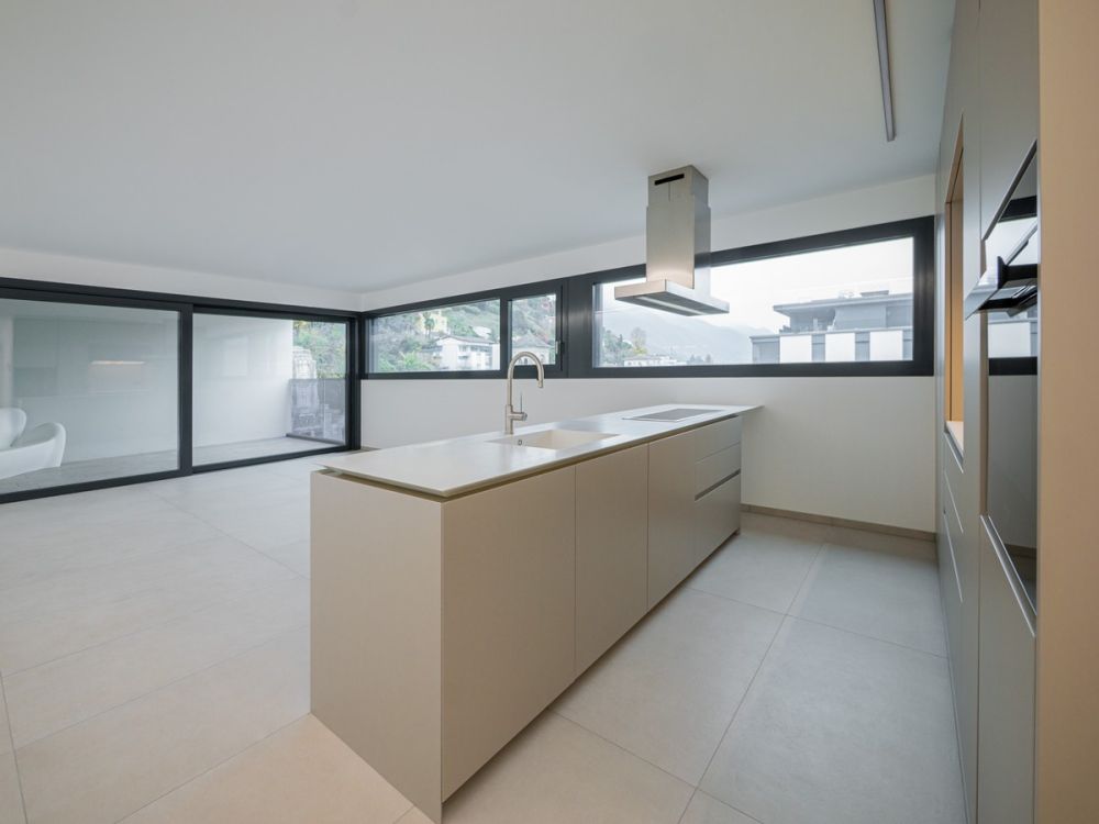 Nuovissimo 2,5 locali in medio-alto standing con terrazza coperta - Bild 1