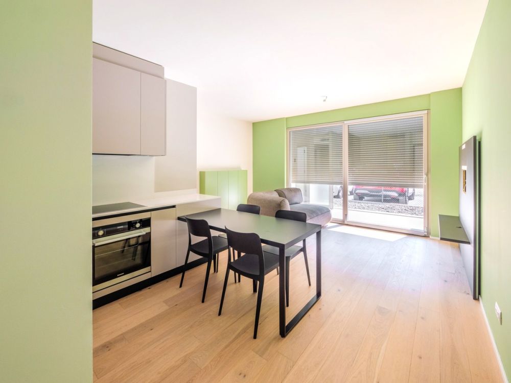 Nuovissimo appartamento 2.5 locali con giardino privato e portico -  Bild 4