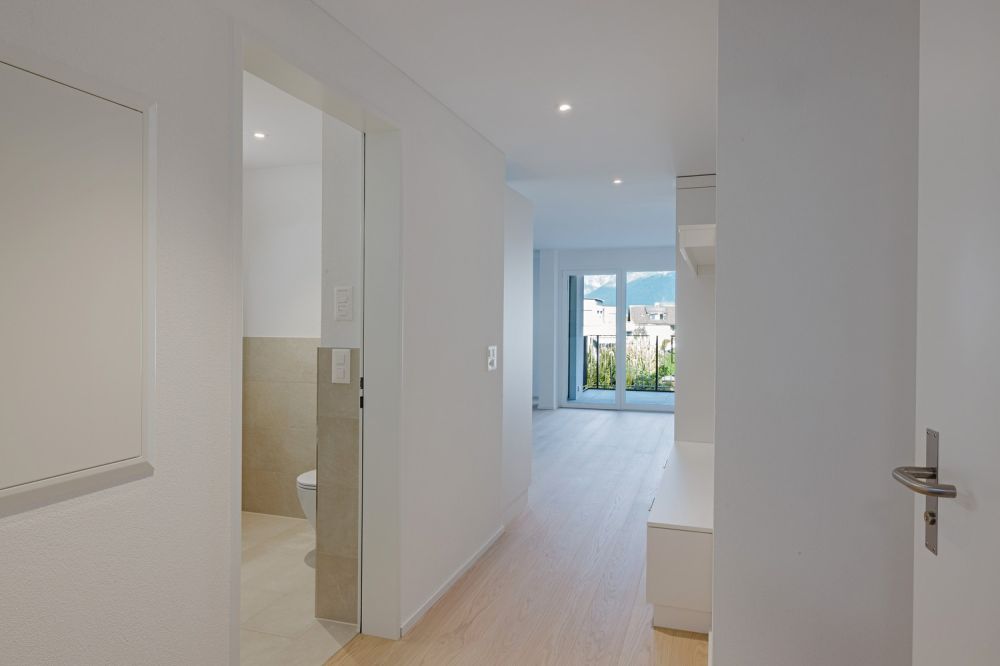 Neubauprojekt Gassu  hochwertige Eigentumswohnungen in Domat/Ems, sofort bezugsbereit - Eingang