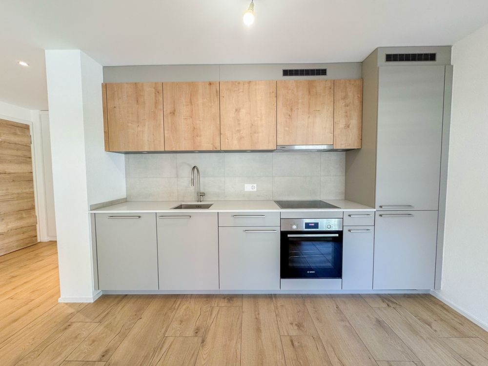 Appt PPE neuf de 2.5 pces avec balcon Campagne Pernod, lot A4 - Cuisine agencée ouverte