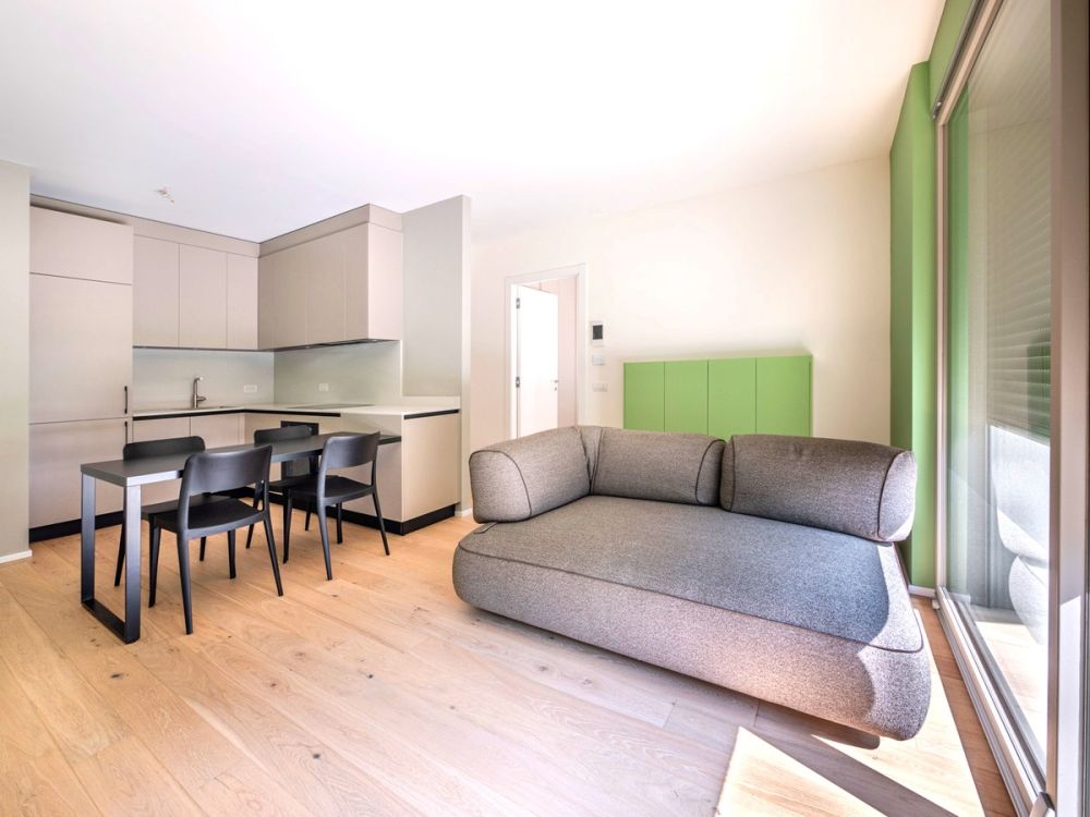 Nuovissimo appartamento 2.5 locali con giardino privato e portico -  Bild 1