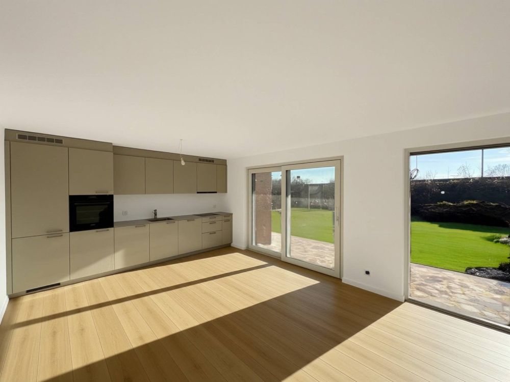 Appartement de 3.5 pièces neuf au rez-de-chaussée avec terrasse - Bild 1