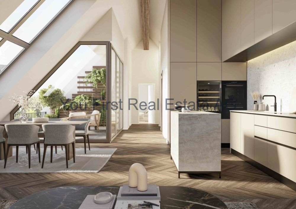 Wohnung W06  Exklusive 2.5-Zimmer-Attikawohnung mit Terrasse - Offene Wohnküche mit Dachfenstern und direktem Terrassenzugang