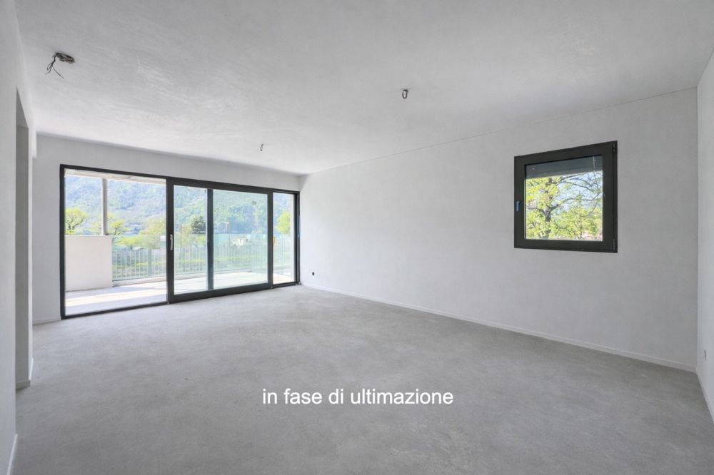 Moderno e nuovo 3.5 locali duplex con giardino a Melano -  Bild 1