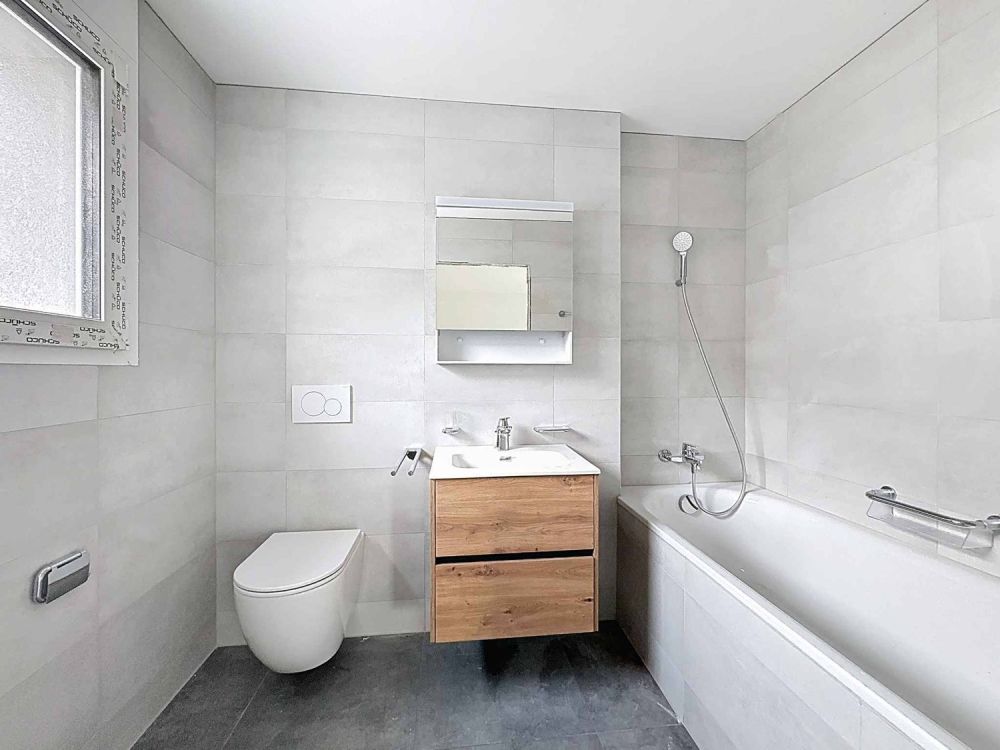 Élégant 3.5 pièces neuf avec deux espaces extérieurs - Bild 4