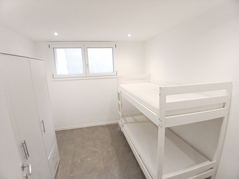 Moderne und helle 3.5-Zimmer-Wohnung mit eigenem Garten in Rivera -  Bild 8