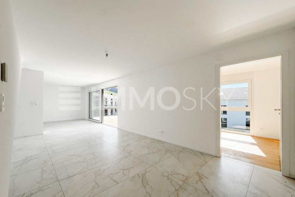 3.5 pièces neuf avec combles d'env. 69 m² et grand balcon (Lot B5-8.1) - Séjour lumineux