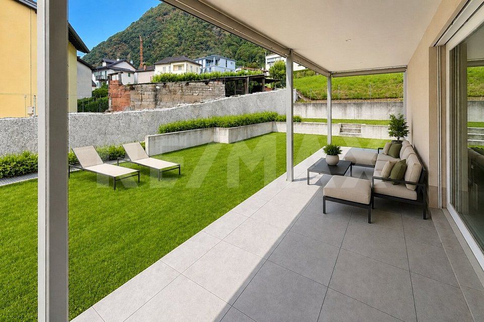 Appartamento 3.5 con giardino e 2 posti auto -  Bild 1