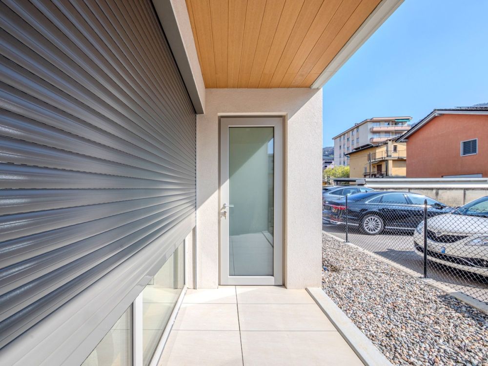 Nuovissimo appartamento 2.5 locali con giardino privato e portico -  Bild 11