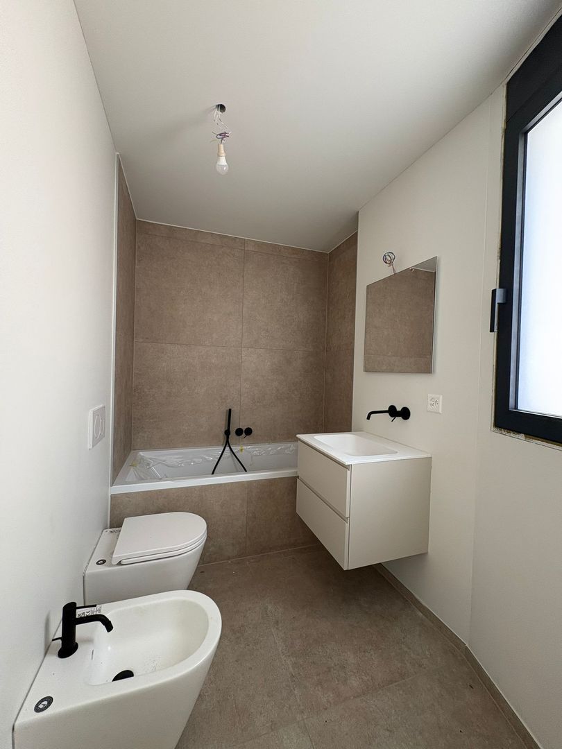 Moderno appartamento di 3.5 locali con ampia terrazza a Giubiasco -  Bild 12