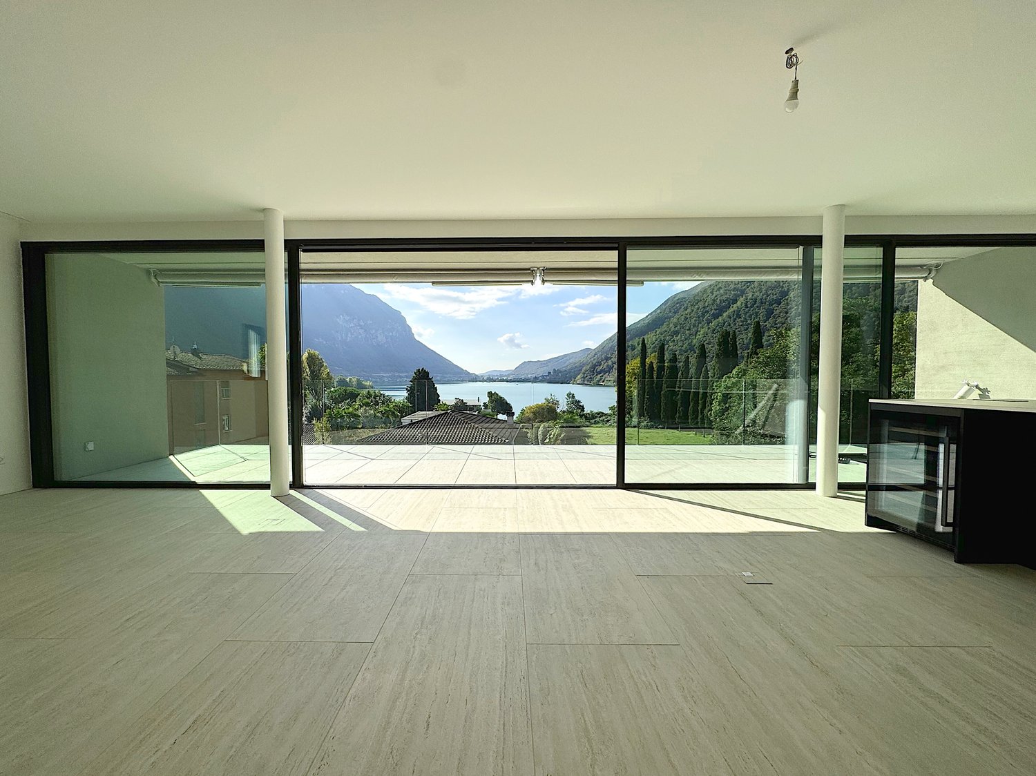 Elegante 4.5 locali al primo piano con terrazza e parziale vista lago -  Bild 12
