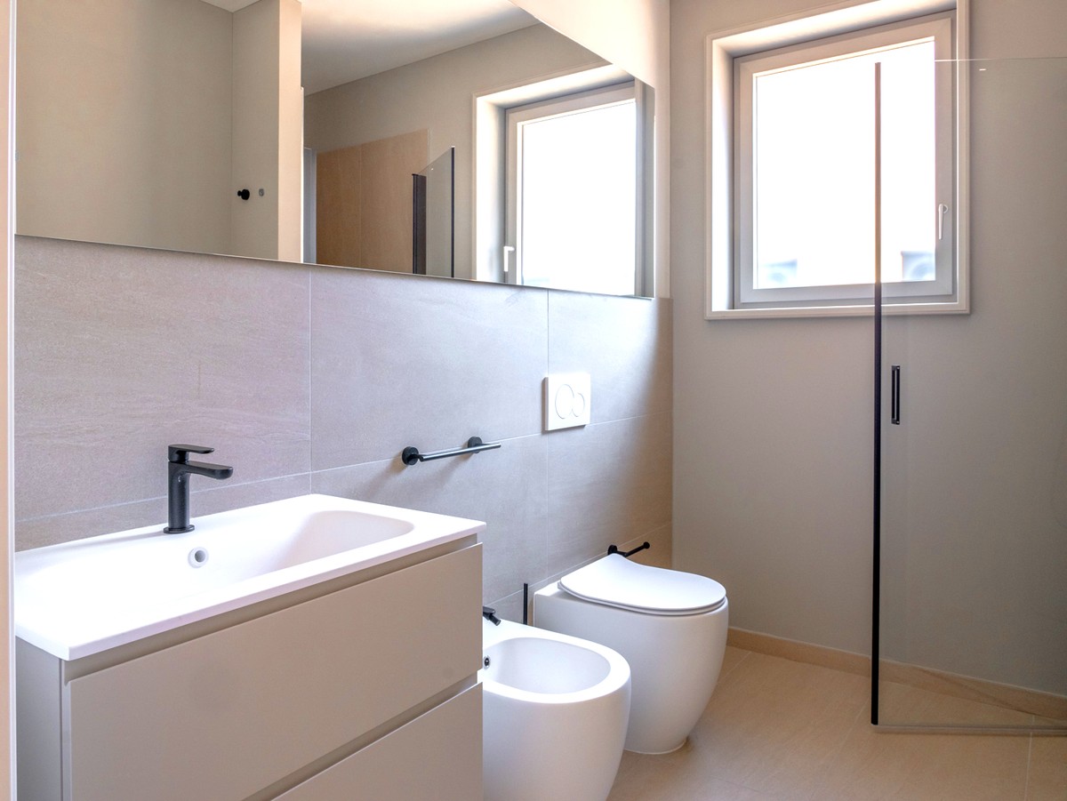 Nuovissimo appartamento 2.5 locali con giardino privato e portico -  Bild 9